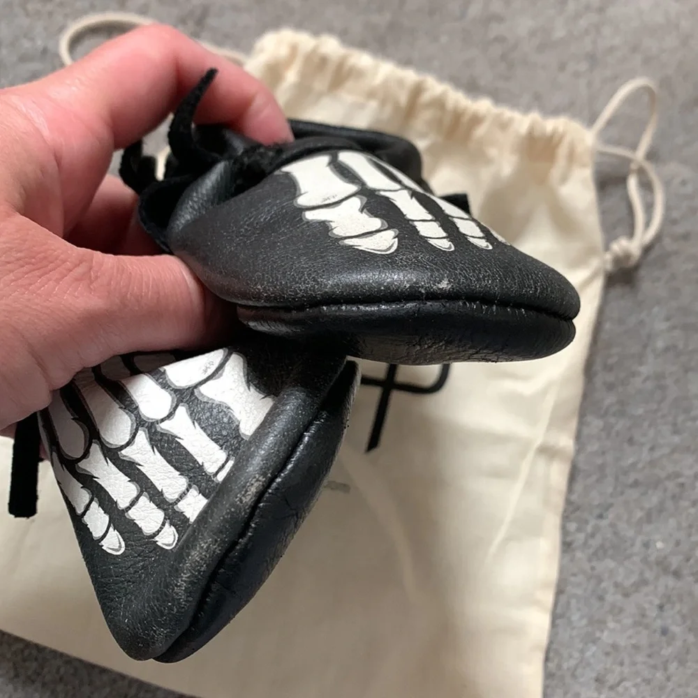Freshly Picked Black Moccasins with White Skeleton Print